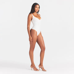 SKIMS BODY UNLINED PLUNGE THONG BODYSUIT | IVORY
