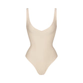 SKIMS BODY UNLINED PLUNGE THONG BODYSUIT | SAND