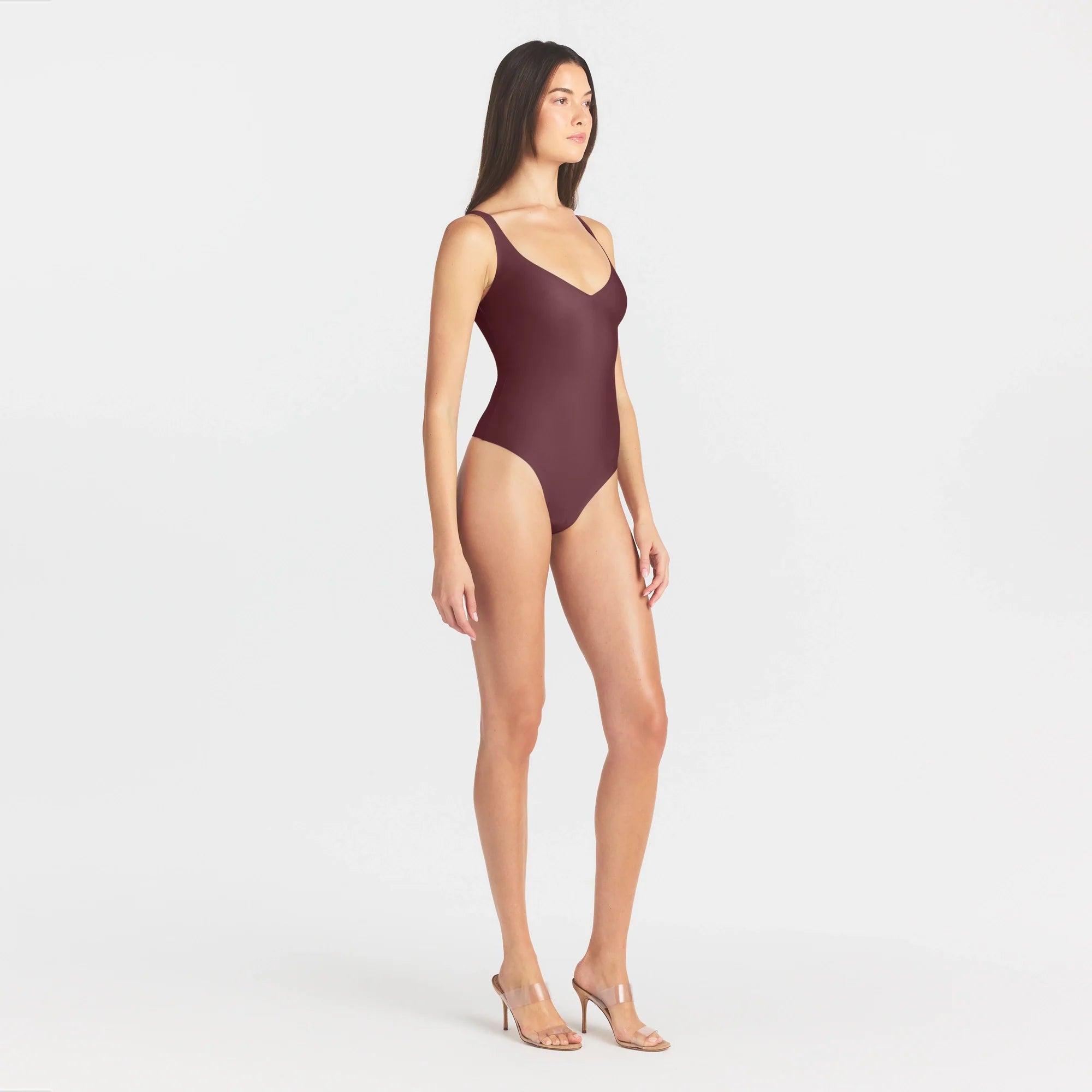 SKIMS BODY UNLINED PLUNGE THONG BODYSUIT | CURRANT