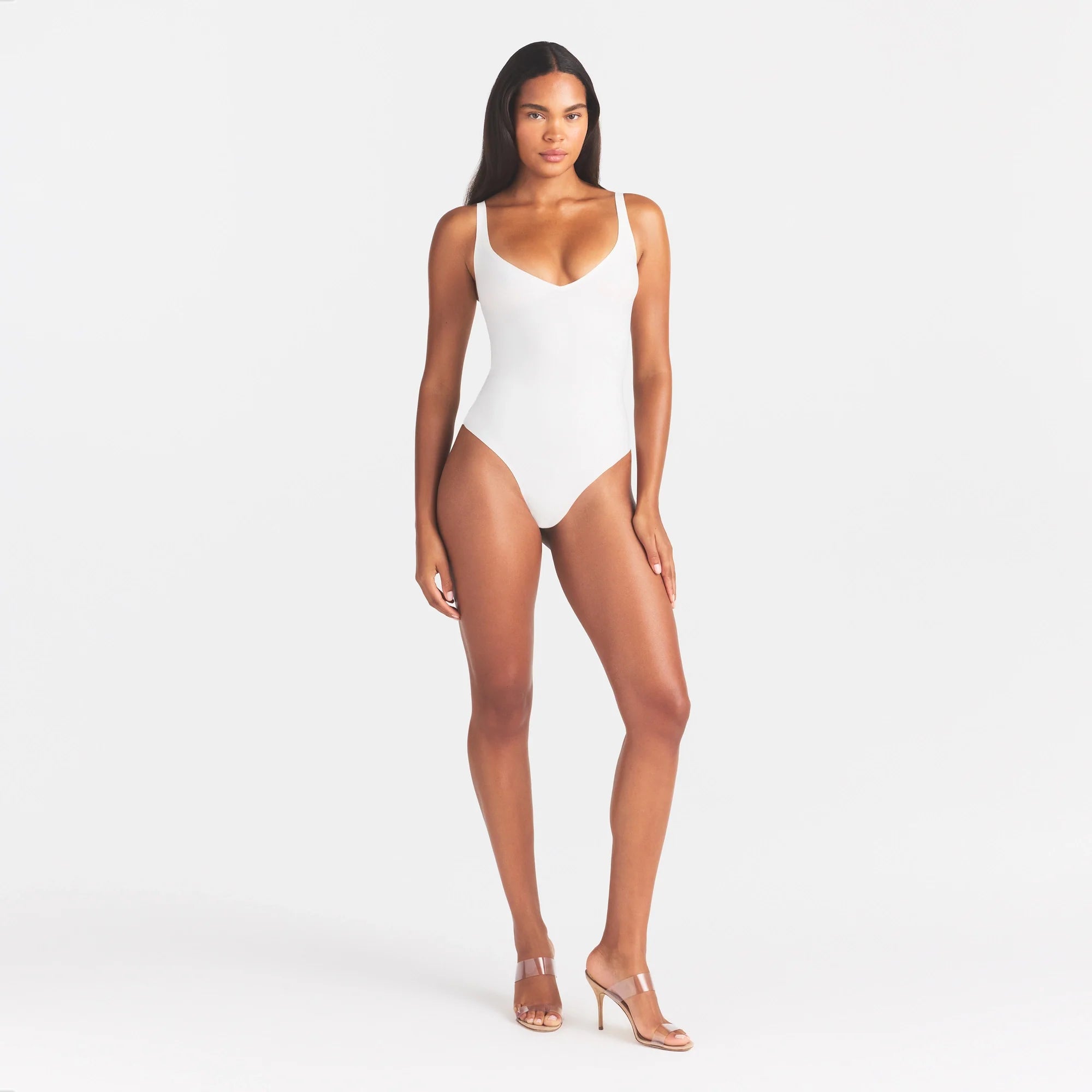 SKIMS BODY UNLINED PLUNGE THONG BODYSUIT | IVORY