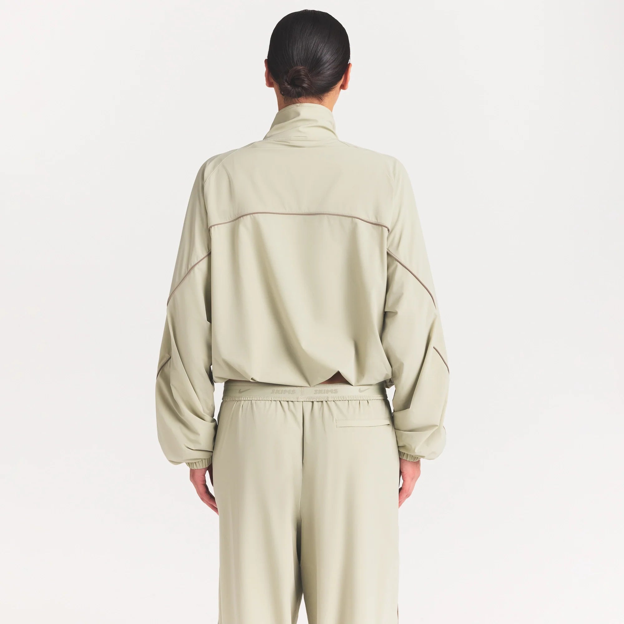 NikeSKIMS STRETCH NYLON OVERSIZED TRACK JACKET | TALC