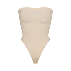 SEAMLESS SCULPT STRAPLESS THONG BODYSUIT | SAND