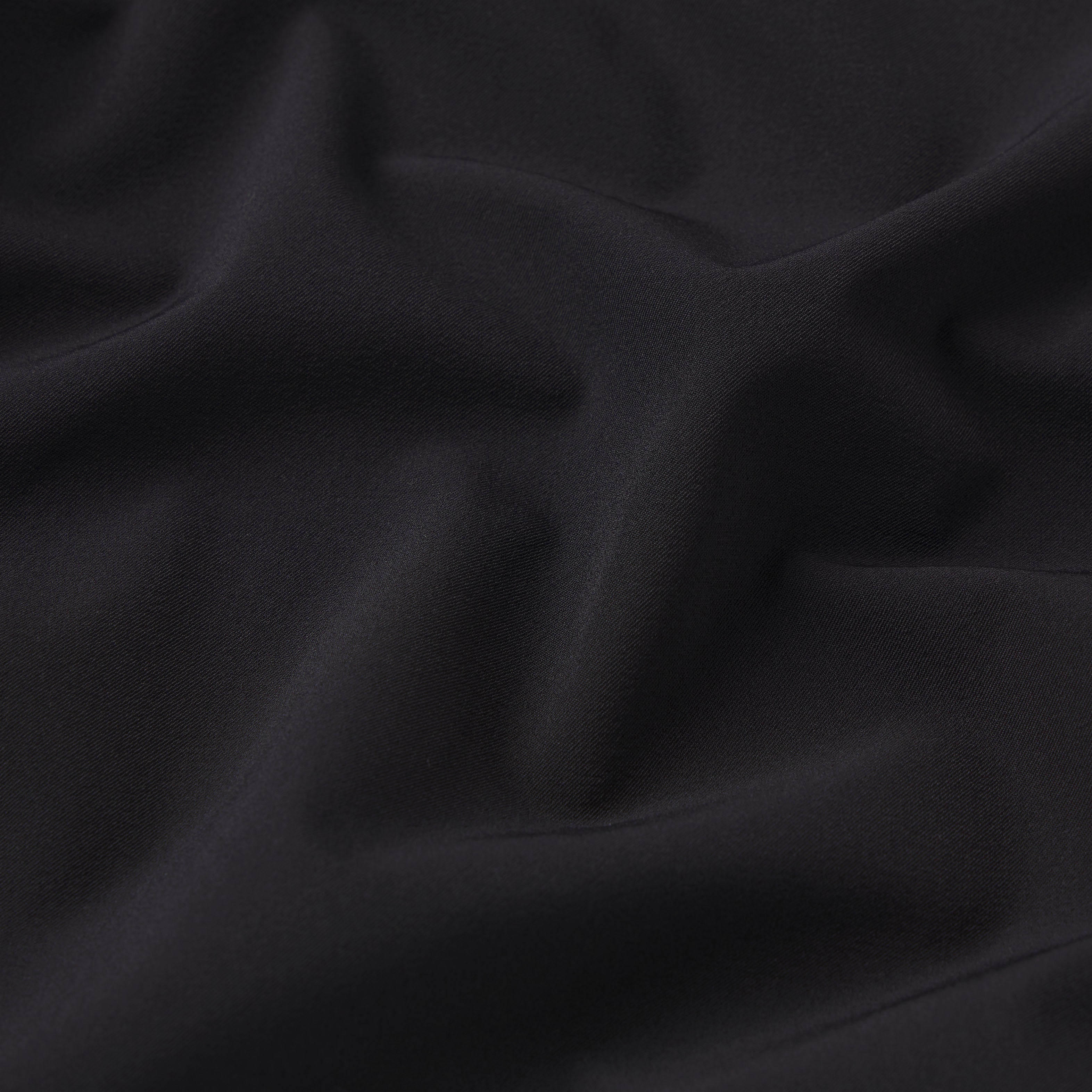 NikeSKIMS STRETCH NYLON RUNNER SHORT | OBSIDIAN